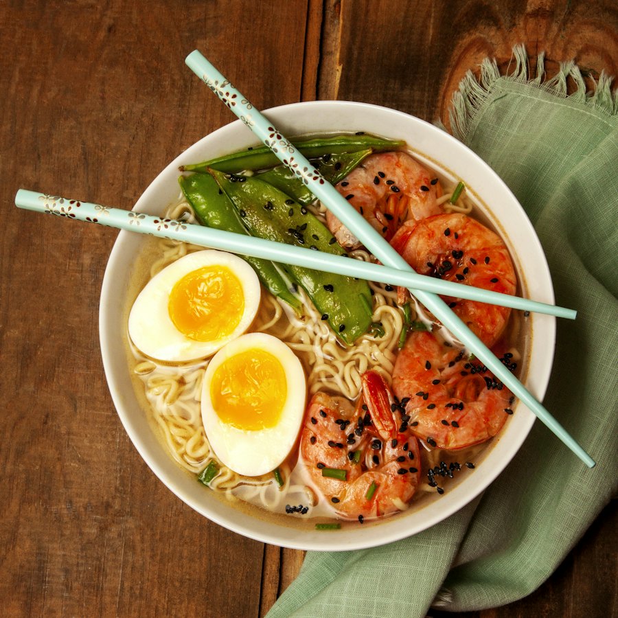 Shrimp ramen with soft egg and chopsticks